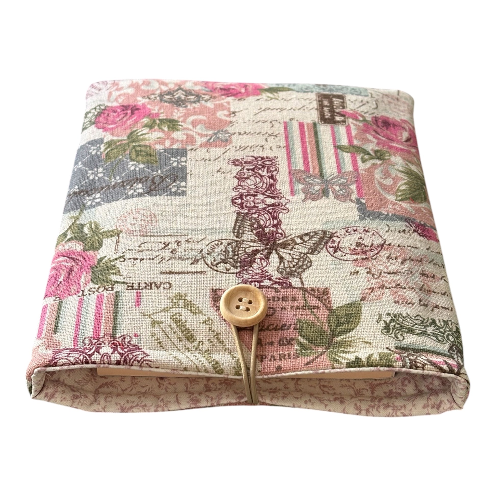 The padded Book Cover has elastic and button fastening which protects the book from slipping out of the Book Pouch.  Please note the book is not included and is for illustrative purposes only.
