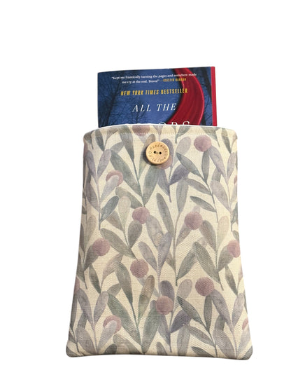 The handmade Book Pouch fastens with button and elastic.  The book is not included and is for illustrative purposes only.