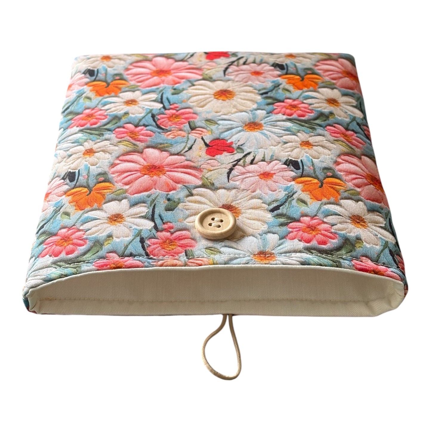 The Book Pouch is padded with fusible wadding, lined with neutral complementing fabric and has elastic and button fastening.