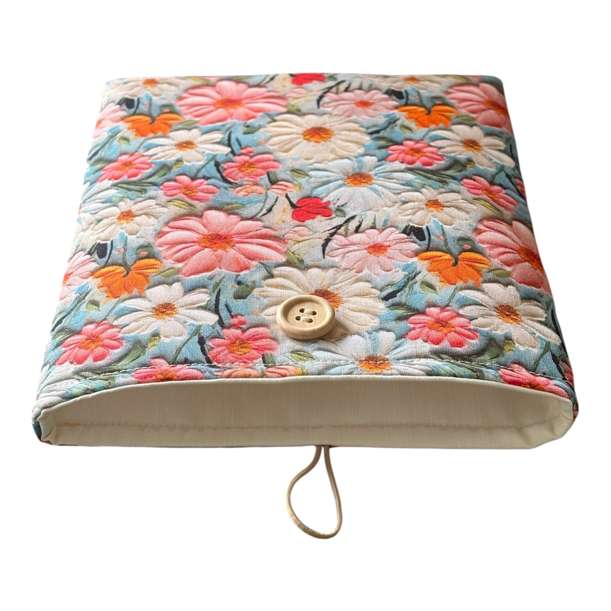The Book Pouch is padded with fusible wadding, lined with neutral complementing fabric and has elastic and button fastening.
