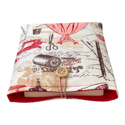 The handmade Book Cover is padded with fusible fleece, is lined with complementing red fabric and has elastic and button fastening to keep books safe.  Please note the book in the listing photo is not included and is for illustrative purposes only.