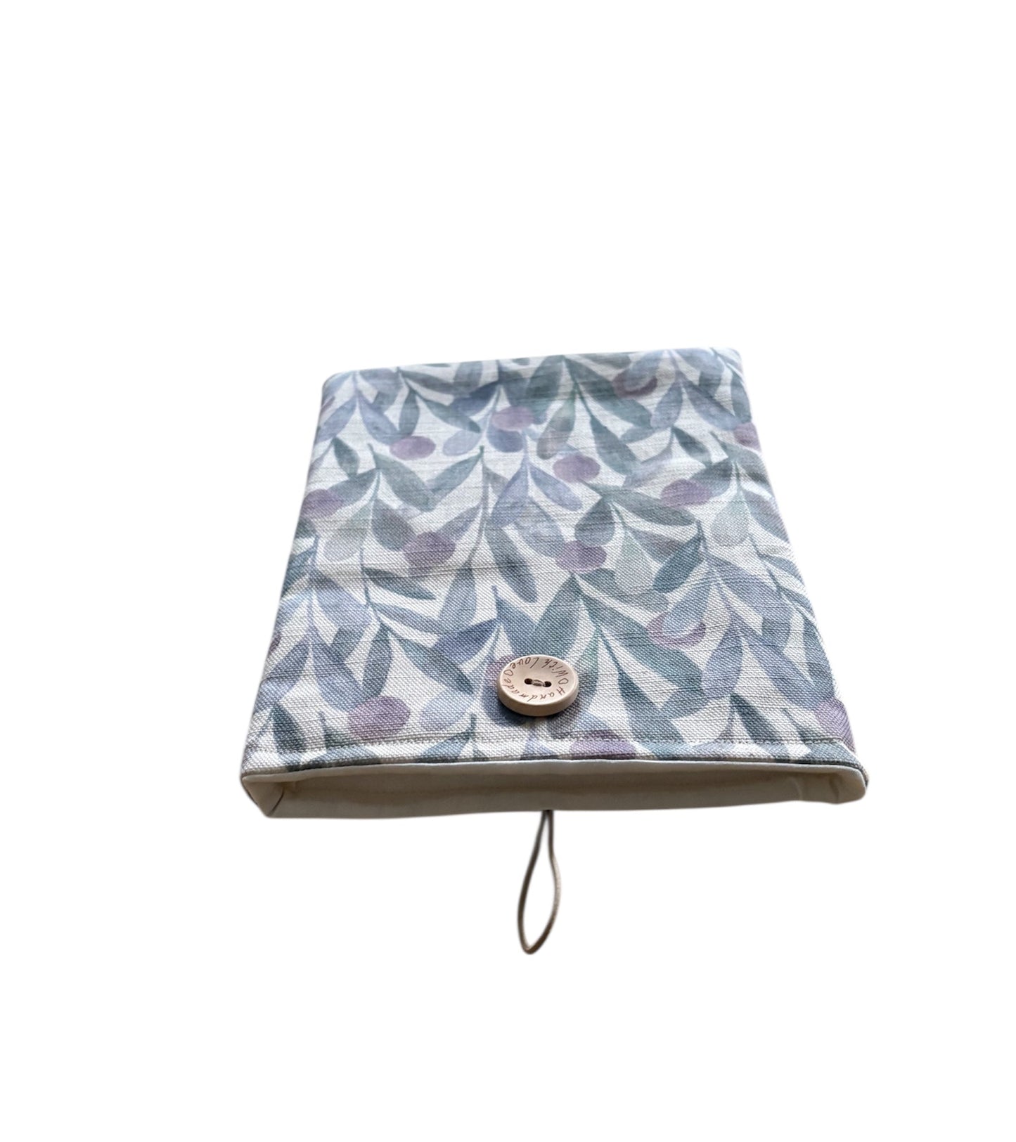 The handmade Katsura Violet Fabric Book Pouch is lined with neutral fabric, padded with fusible wadding and has elastic and button fastening.