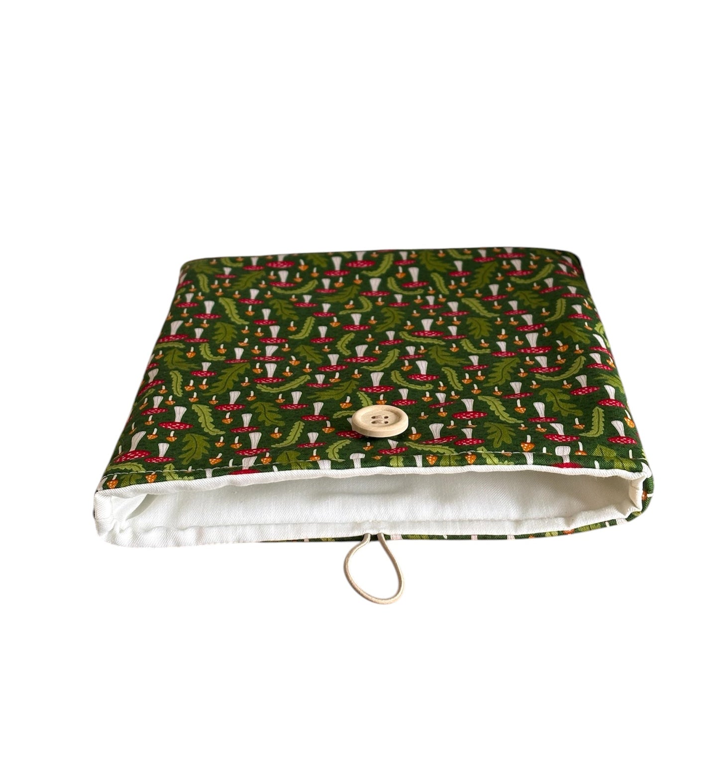 The handmade Book/Kindle Cover is padded with fusible wadding, lined with neutral fabric and has elastic and button fastening.