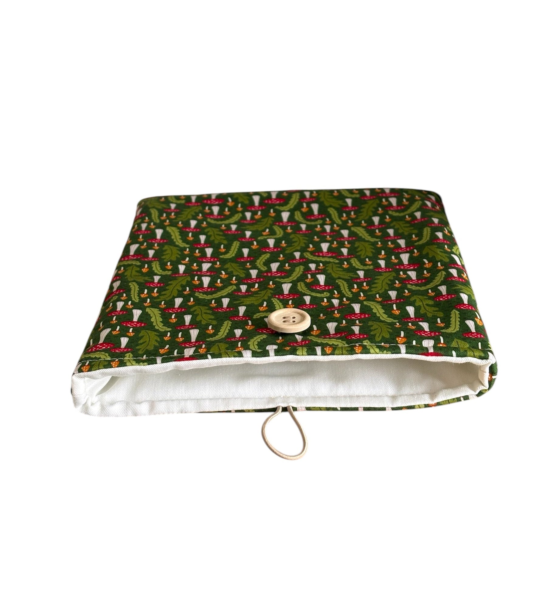 The handmade Book/Kindle Cover is padded with fusible wadding, lined with neutral fabric and has elastic and button fastening.