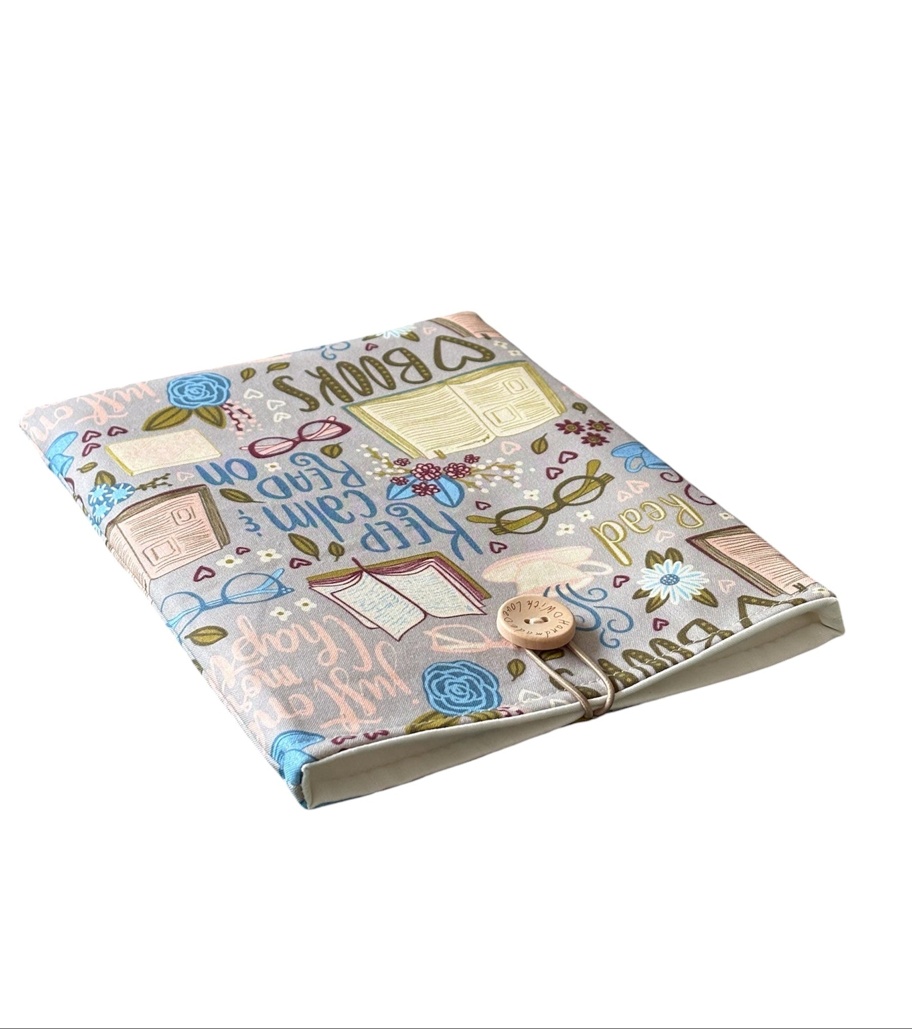 The patterned fabric includes the wording Keep Calm & Read on, open books, glasses and Just One More Chapter.  Please note pattern placement may differ from listing photo.