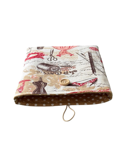 The Book Pouch is lined with complementing polka dot fabric and has elastic and button fastening.