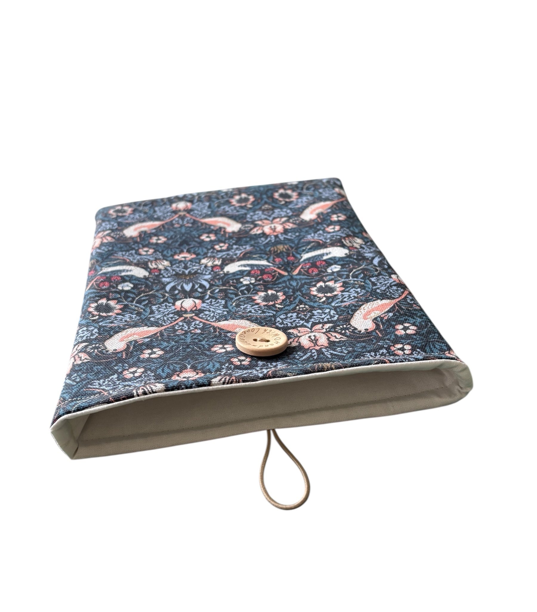 The photo of the Book Pouch shows more of the neutral fabric which lines the handmade Book Cover and elastic and button used which provides closure of the Book Pouch.