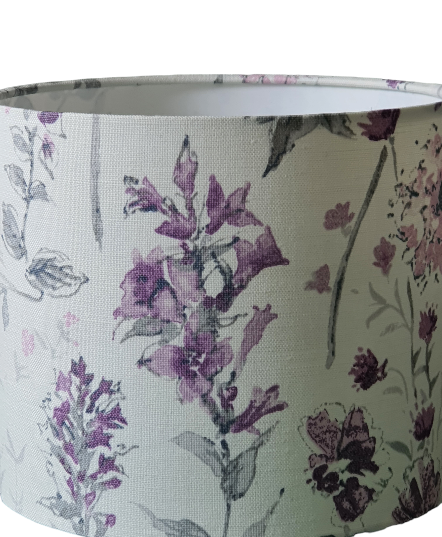 A close up of the Wild Meadow patterned fabric.  The pattern colour is shades of lilac on a light background.