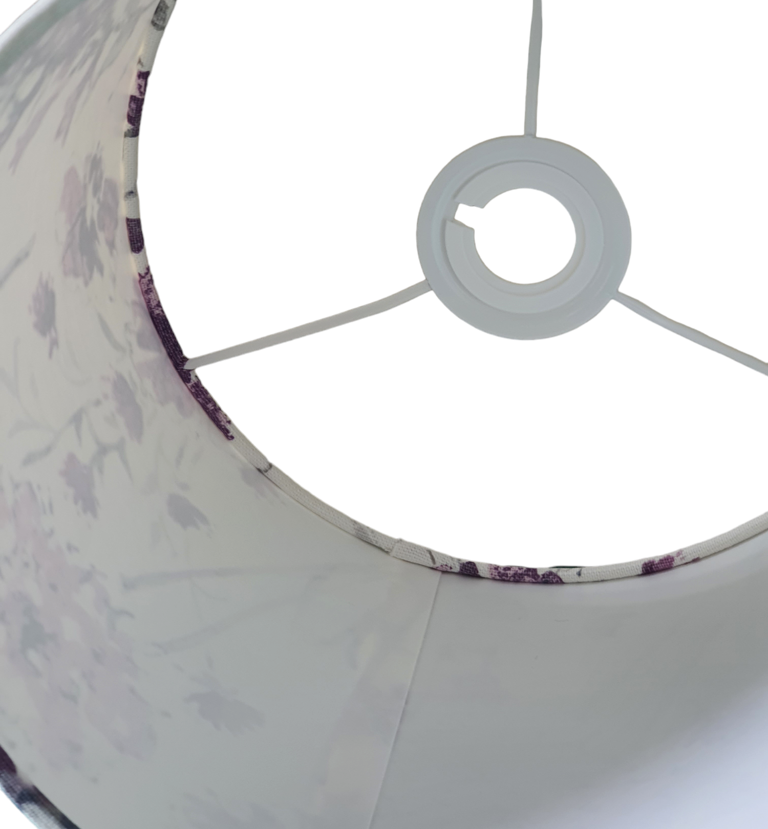 A view looking inside the shade towards the ring and the tucking in of the fabric can be seen and the join on the inside of the shade.