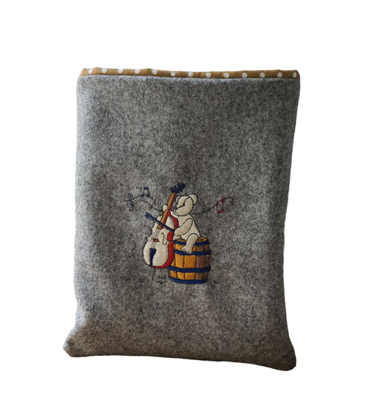 Handmade, padded embroidered book cover with colour pattern of a bear playing a cello