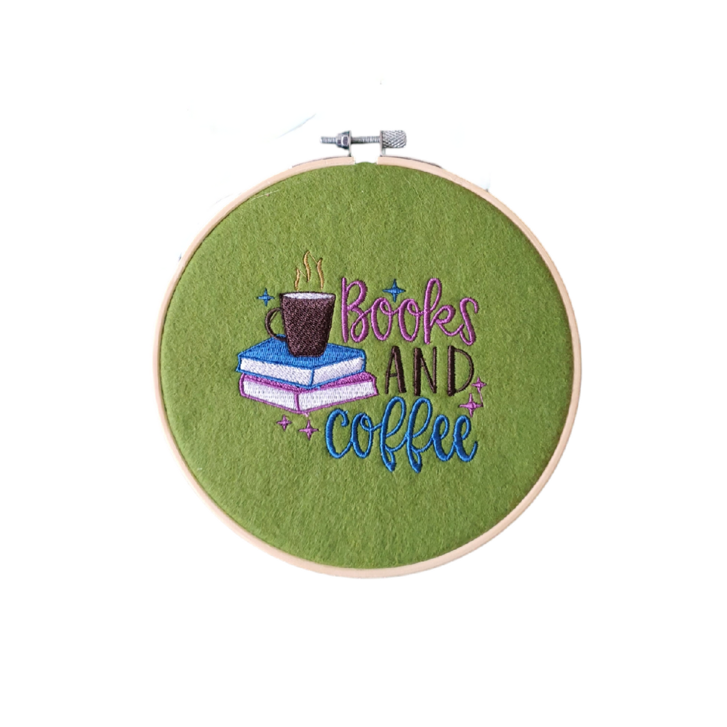 Machine embroidered Books and Coffee pattern on green felt and mounted in a 6 inch Bamboo Hoop.  This wall hanging hoop would  be a great idea as a Book Lovers Gift for their favourite place to read.