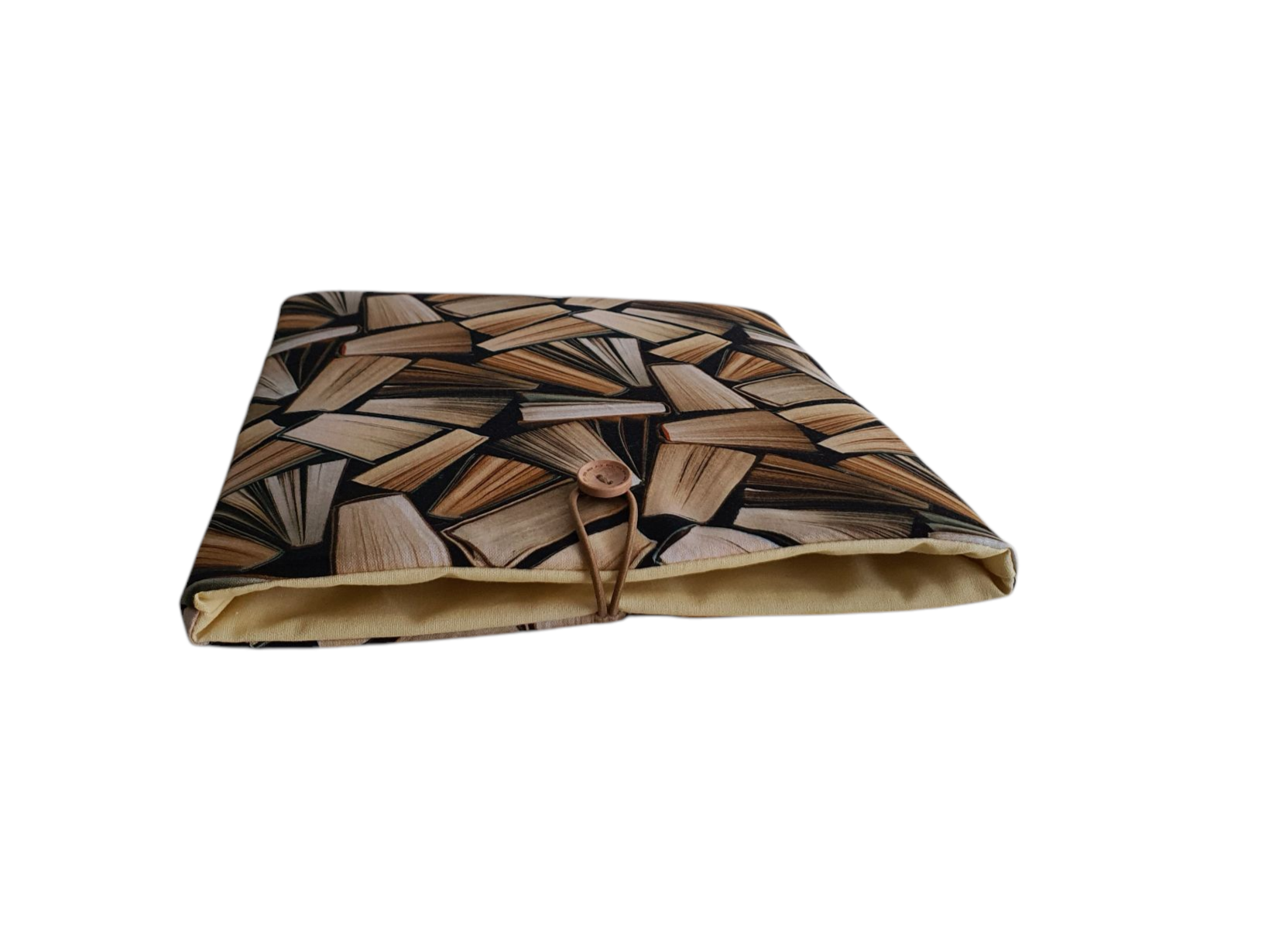 The padded Book Sleeve fastens with elastic and a button.
